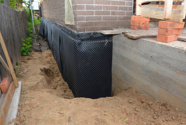 SJ Waterproofing Pros technician performing targeted Waterproofing assessment in Mobile, AL